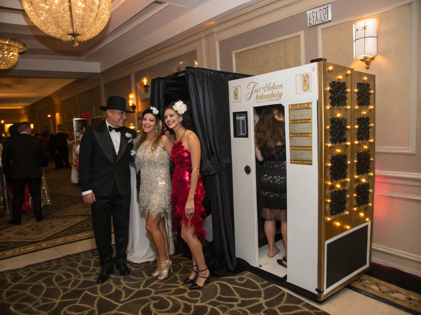 A vibrant photo booth at a red carpet event, complete with professional lighting, luxurious backdrops, and guests posing in their finest attire.